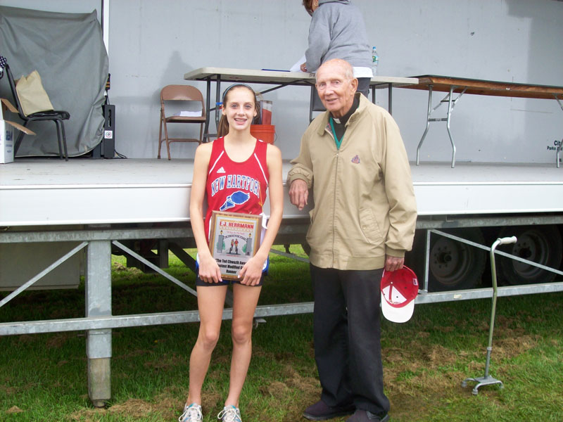 Image of the Ted Chwazik Award award winner Juliet Hull from New Hartford, presented by Monsignor Francis J. Willenburg