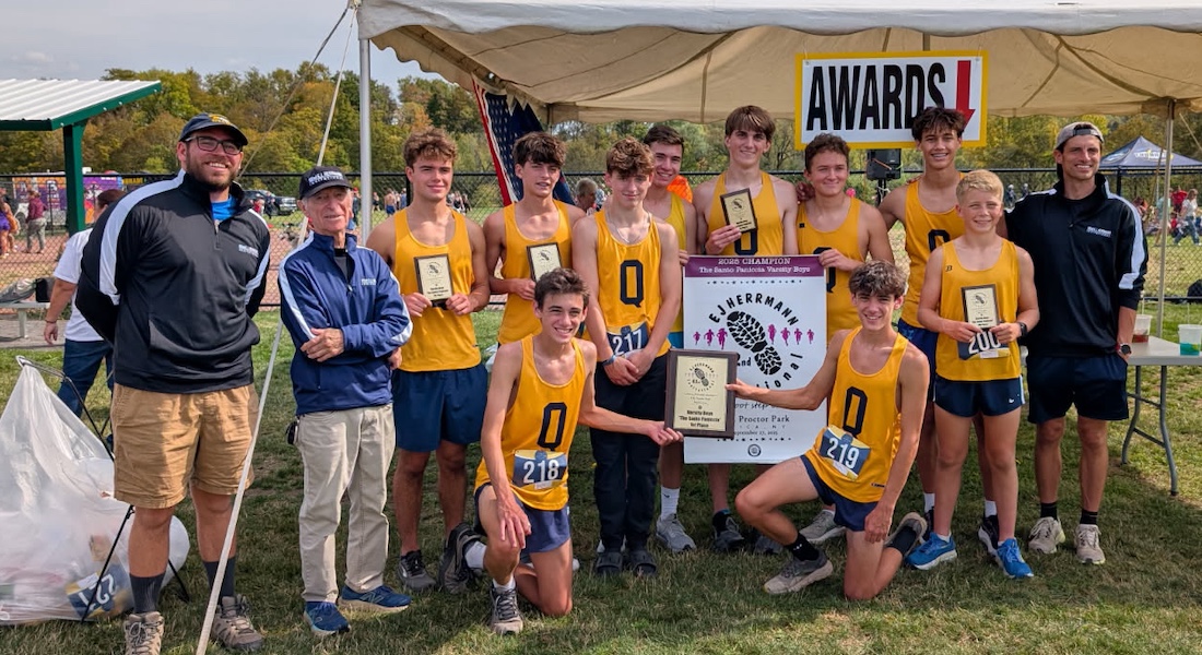 Image of the Santo Paniccia Boys Varsity winning team Queensbury, presented by Mr. Santo Paniccia