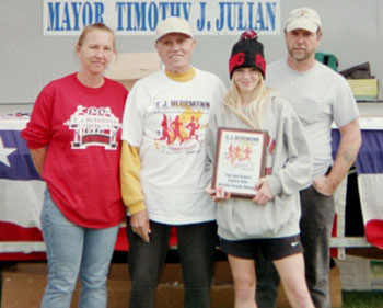 Image of Heather Vroman receives the Sam Gratch Award for the fastest elite/varsity female runner