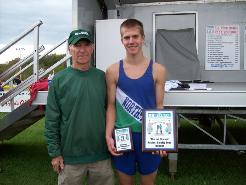 Image of the Joe Ficcaro Award award winner Chris Buchanan from Cicero-North Syracuse, presented by Mr. Santo Paniccia