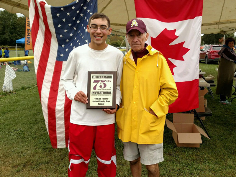 Image of the Joe Ficcaro Award award winner Josh Farmer from New Hartford, presented by Mr. Santo Paniccia