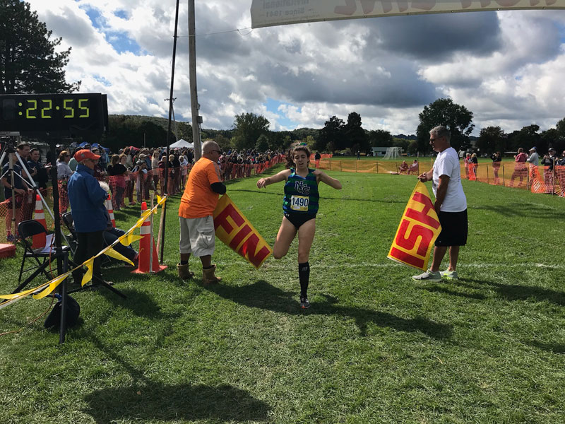 Image of the Utica Police and Fire Fighters Memorial Girls JV race winner Savannah Kuhr from Cicero-North Syracuse