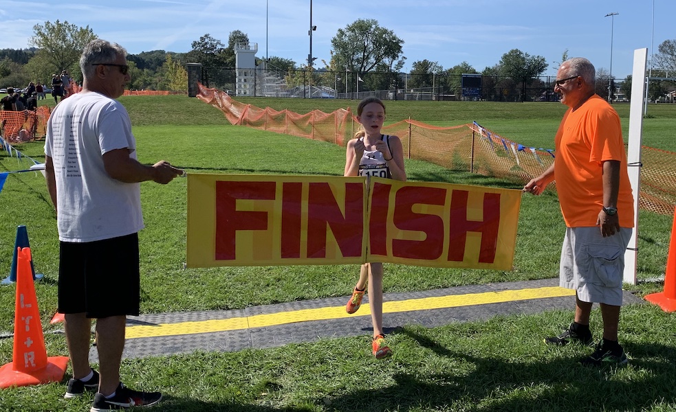 Image of the Utica Police and Fire Fighters Memorial Girls JV race winner Ella Marriner from Mohonasen