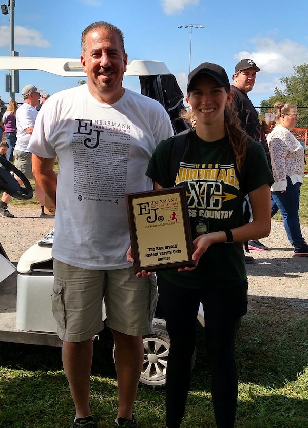 Image of the Sam Gratch Award award winner Cora Hinsdill from Adirondack, presented by Mr. Dan Amado, E. J. Herrmann Invitational co-director
